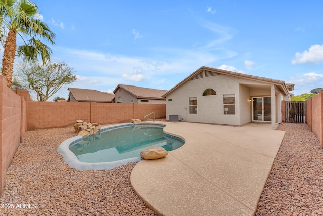 view of swimming pool with a patio area, a fenced backyard, central AC, and a fenced in pool