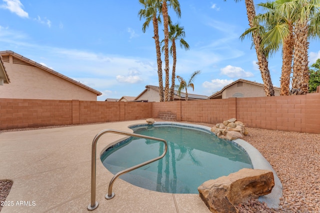 view of pool featuring a fenced in pool, a patio area, and a fenced backyard