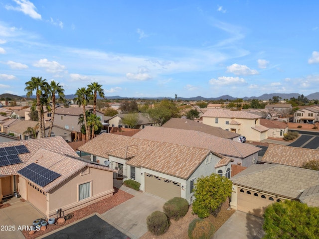 birds eye view of property with a residential view and a mountain view