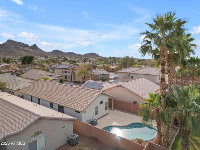 birds eye view of property featuring a mountain view and a residential view