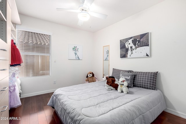 bedroom with ceiling fan and dark hardwood / wood-style floors