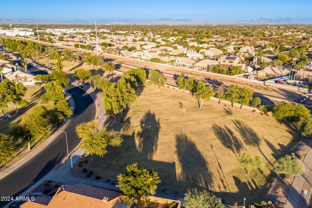 birds eye view of property featuring a mountain view