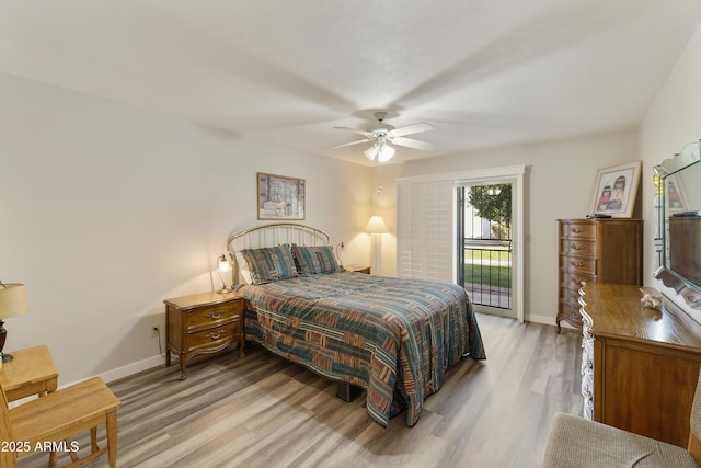 bedroom with access to exterior, light hardwood / wood-style flooring, and ceiling fan