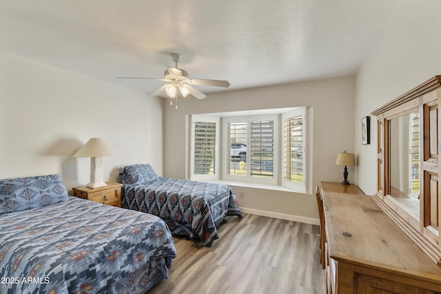 bedroom featuring ceiling fan and light hardwood / wood-style floors