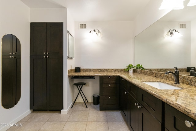 bathroom with tile patterned flooring and sink