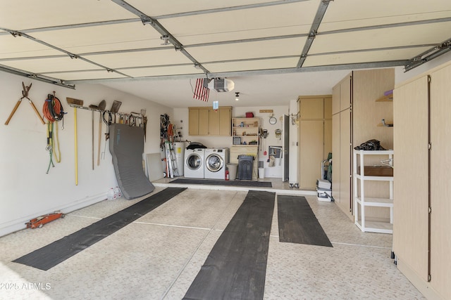 garage featuring a garage door opener and washing machine and clothes dryer