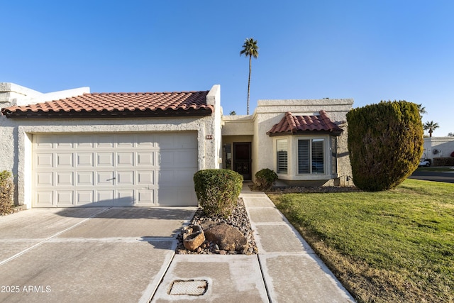 view of front of house with a garage and a front yard