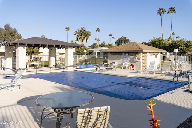 view of swimming pool with a gazebo and a patio area