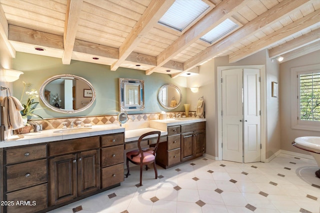 bathroom with vanity, wooden ceiling, vaulted ceiling with beams, and backsplash