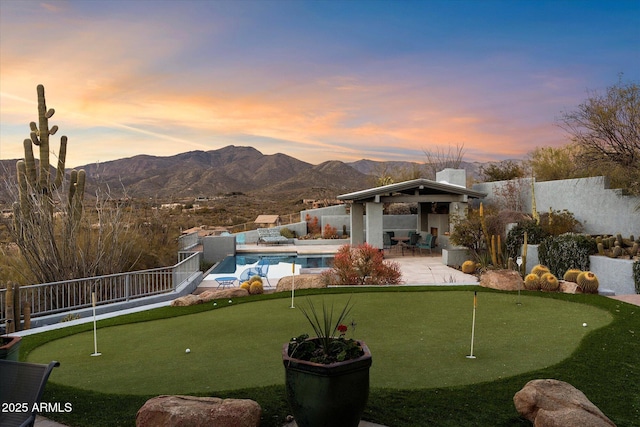 view of home's community featuring a mountain view, a gazebo, a patio, and a pool