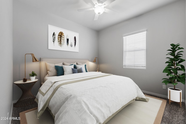 bedroom with dark carpet and ceiling fan