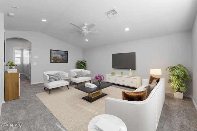 carpeted living room featuring vaulted ceiling and ceiling fan