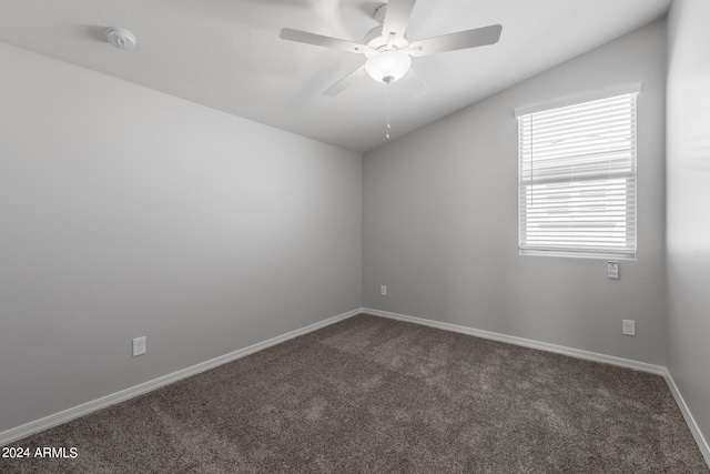 spare room with carpet floors, ceiling fan, and vaulted ceiling