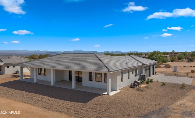 29811 N 154th St, Scottsdale, AZ 85262 - back of property with a mountain view, a tile roof, a patio, stucco siding, and driveway