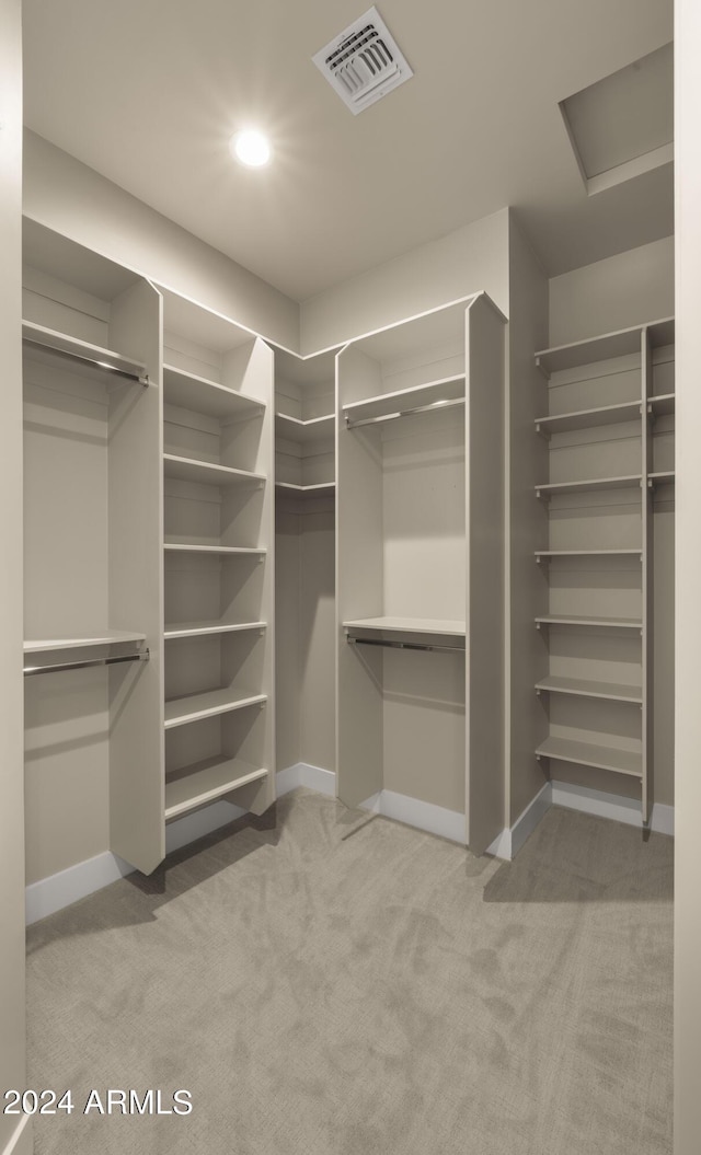 29811 N 154th St, Scottsdale, AZ 85262 - walk in closet with visible vents, attic access, and light carpet