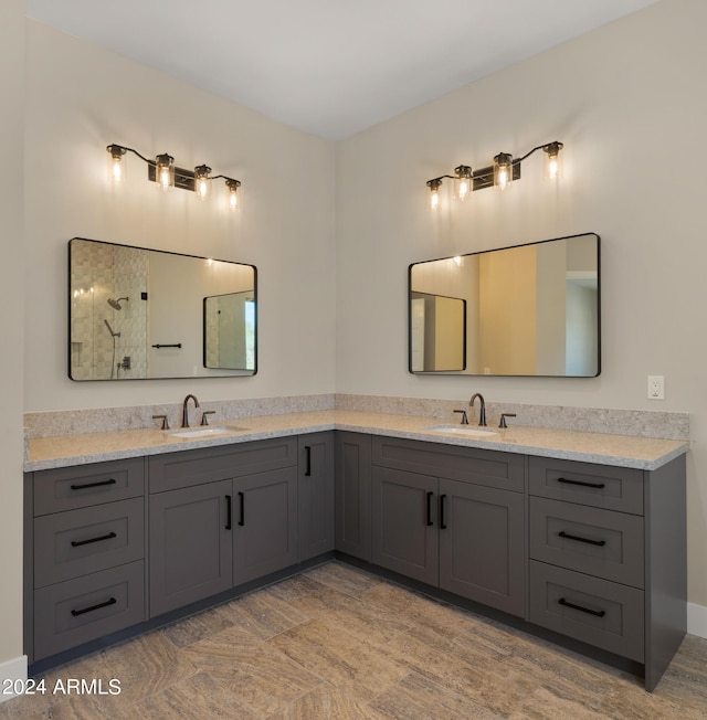 bathroom featuring walk in shower and vanity