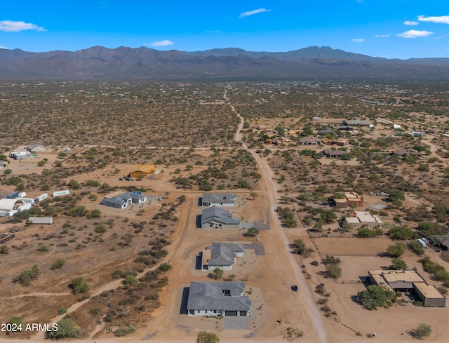 birds eye view of property with a mountain view