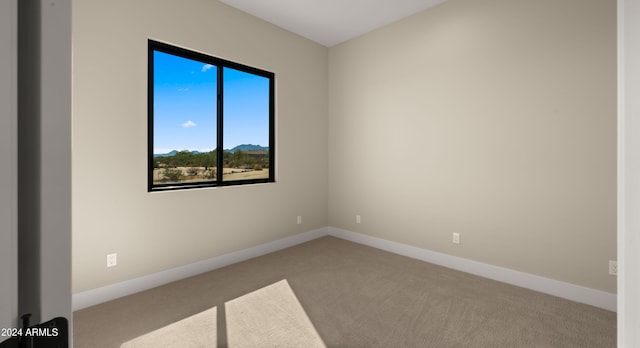 empty room featuring light colored carpet