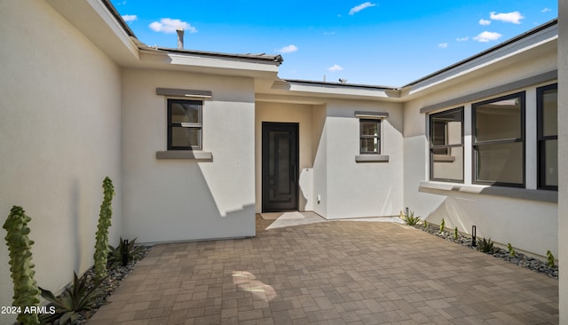 property entrance with a patio area