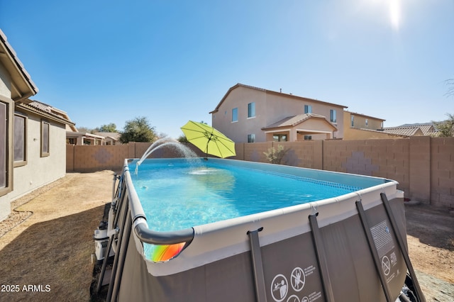 view of pool with a fenced backyard and a fenced in pool