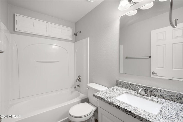 full bathroom featuring washtub / shower combination, vanity, and toilet