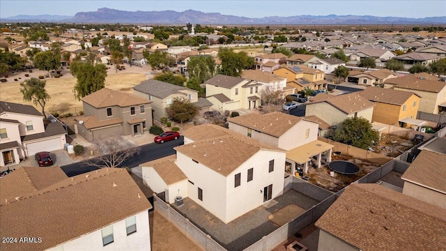 birds eye view of property with a mountain view