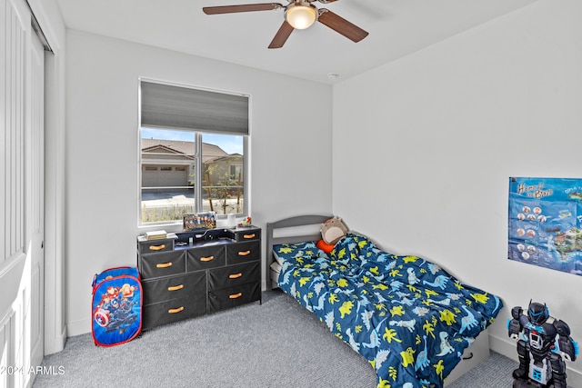 bedroom with carpet flooring, ceiling fan, and a closet