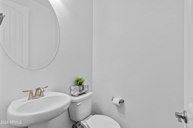 bathroom with sink and toilet