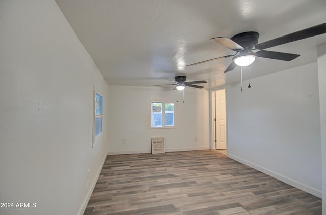 empty room with hardwood / wood-style floors