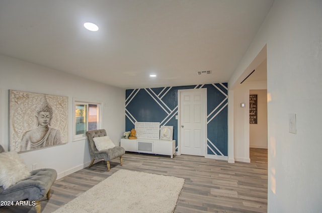 living area featuring hardwood / wood-style floors