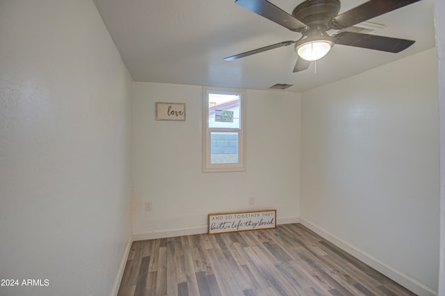 unfurnished room featuring hardwood / wood-style flooring and ceiling fan