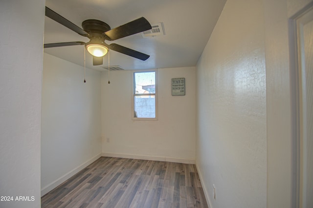 unfurnished room with ceiling fan and wood-type flooring