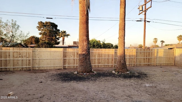 view of yard at dusk