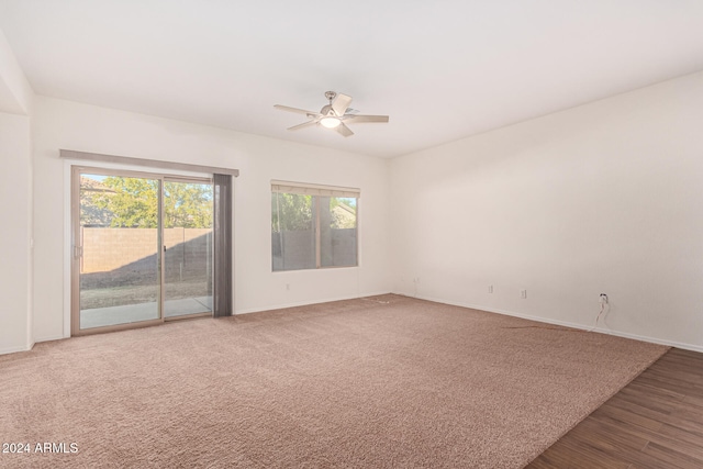 spare room with wood-type flooring and ceiling fan