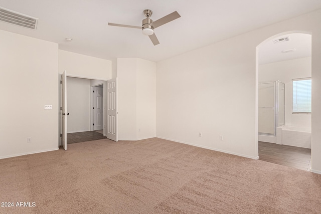 carpeted empty room with ceiling fan