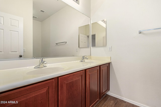 bathroom with vanity and hardwood / wood-style flooring