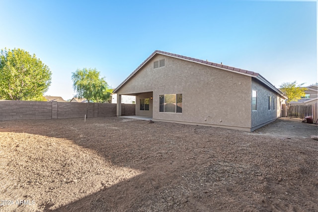 rear view of house with a patio