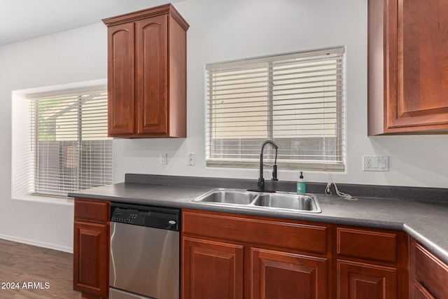 kitchen featuring dark hardwood / wood-style flooring, sink, and stainless steel dishwasher