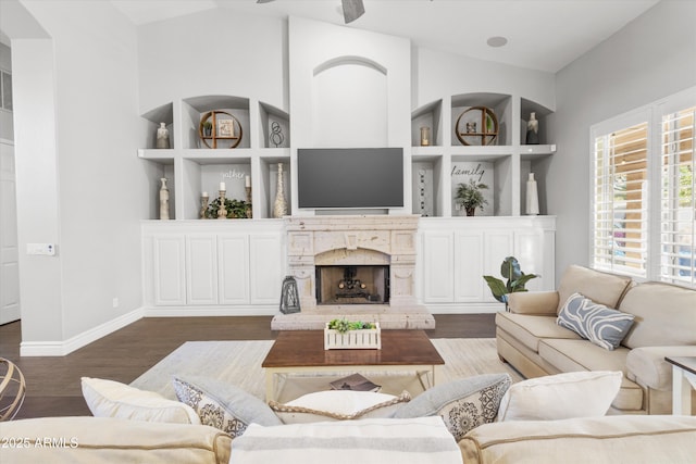 living room featuring dark wood-type flooring and lofted ceiling