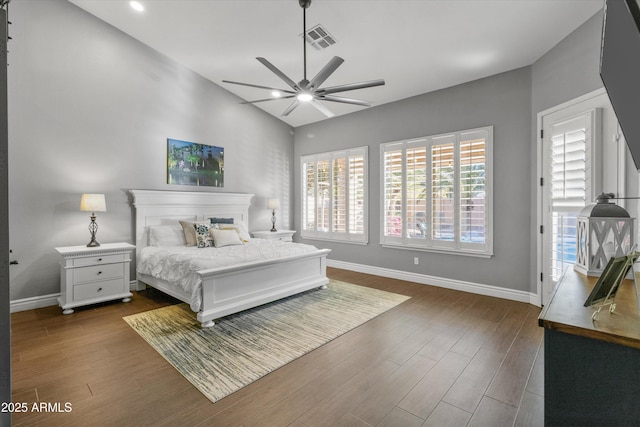 bedroom with ceiling fan, dark wood-type flooring, access to exterior, and lofted ceiling