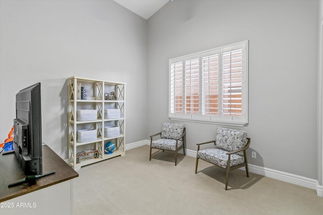 living area featuring light colored carpet