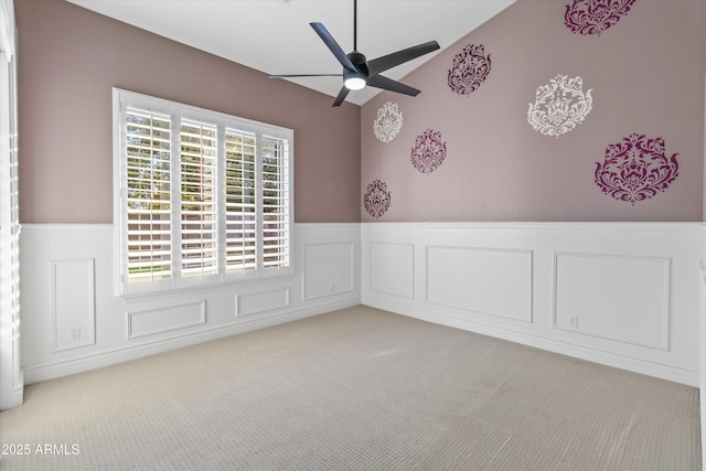 carpeted empty room with lofted ceiling and ceiling fan