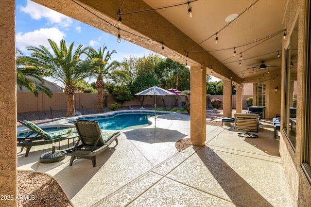 view of swimming pool with a patio area