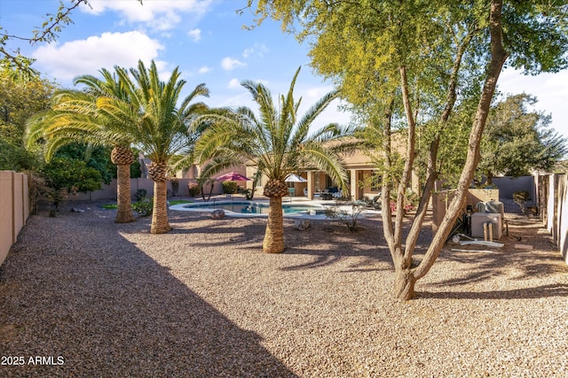 view of jungle gym featuring a patio area and a fenced in pool