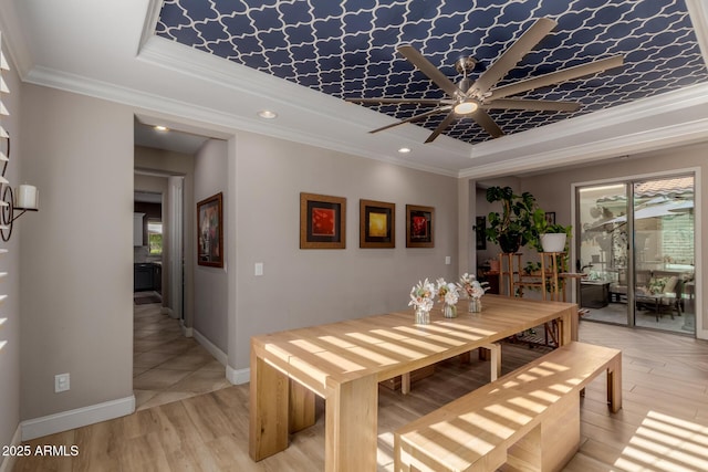 16178 W Granada Rd, Goodyear, AZ 85395 - dining space featuring a raised ceiling, a ceiling fan, plenty of natural light, crown molding, and recessed lighting