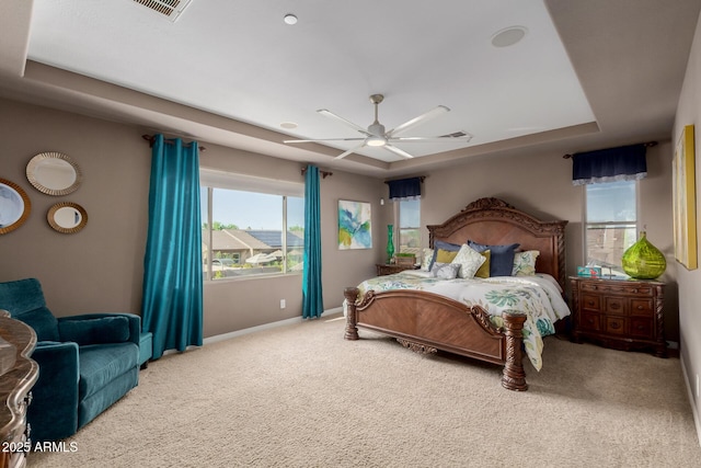 16178 W Granada Rd, Goodyear, AZ 85395 - bedroom with carpet flooring, a tray ceiling, and a ceiling fan