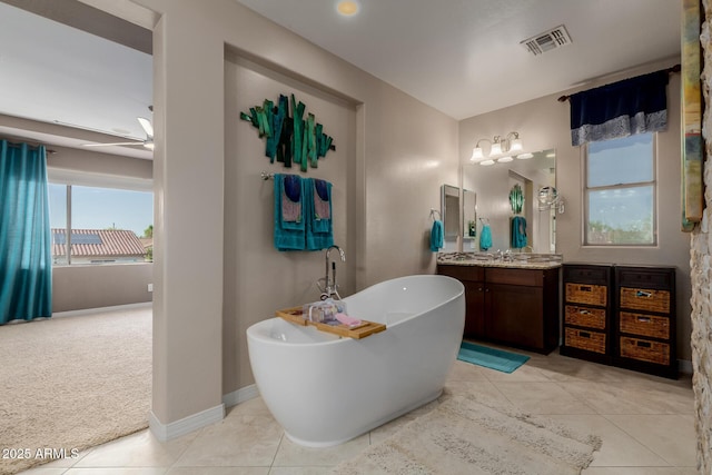 16178 W Granada Rd, Goodyear, AZ 85395 - full bathroom featuring vanity, a soaking tub, and tile patterned floors