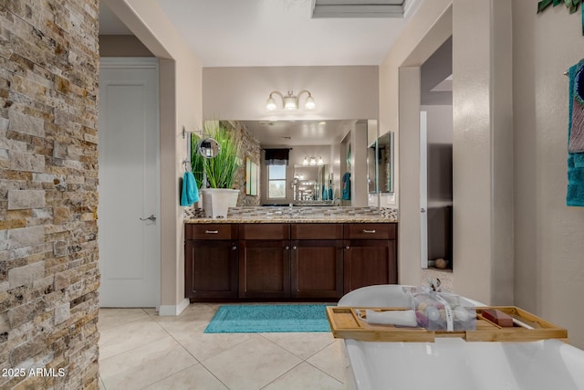16178 W Granada Rd, Goodyear, AZ 85395 - bathroom featuring a soaking tub, tile patterned floors, vanity, and a chandelier