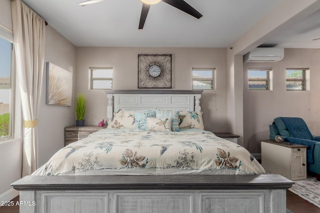 16178 W Granada Rd, Goodyear, AZ 85395 - bedroom with an AC wall unit, dark wood-style flooring, and a ceiling fan