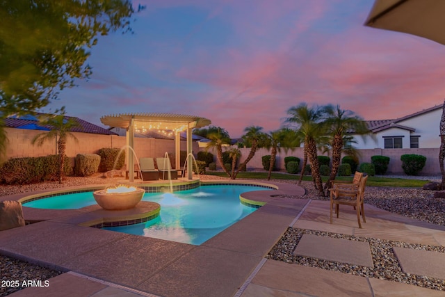 16178 W Granada Rd, Goodyear, AZ 85395 - pool at dusk with a jacuzzi, a fenced backyard, a patio area, and a pergola